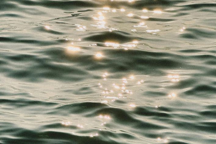 A photo of the water with the sun shining on it