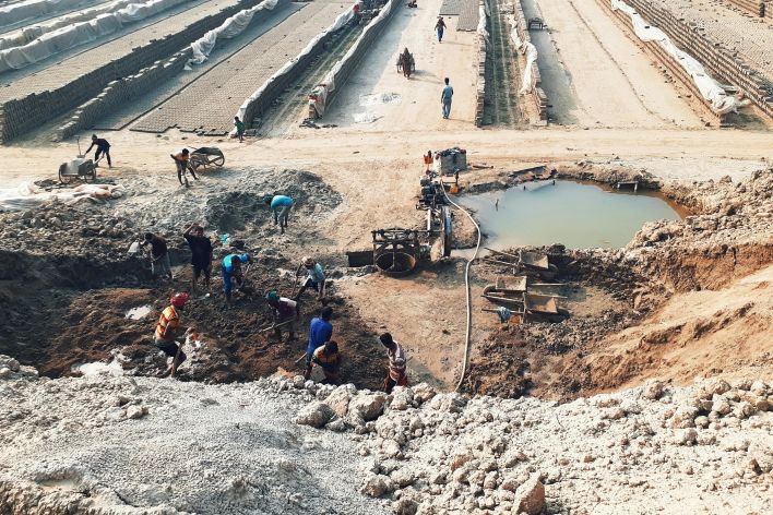 Men Digging and Working